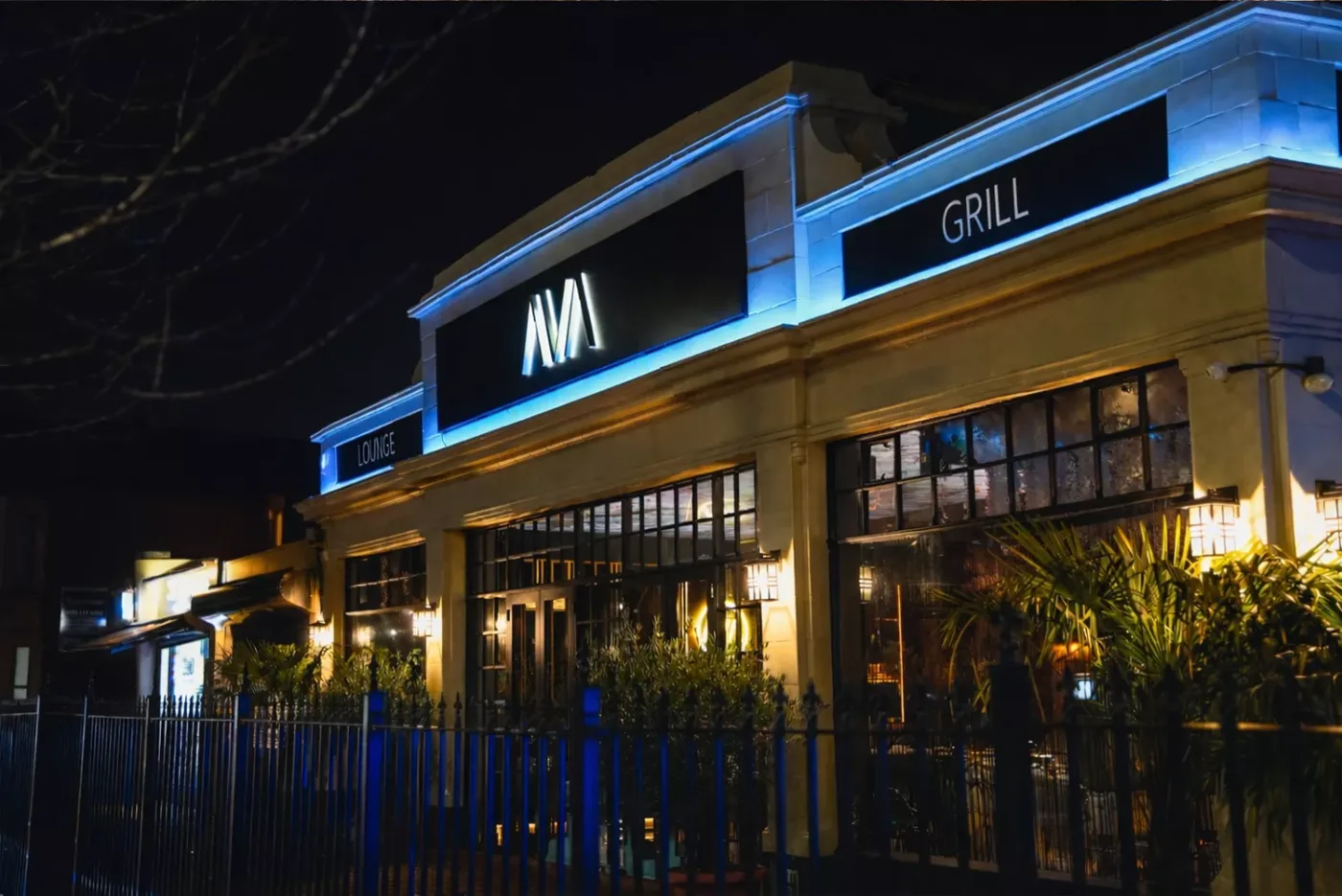 AVA Steakhouse exterior lit at night in Romford