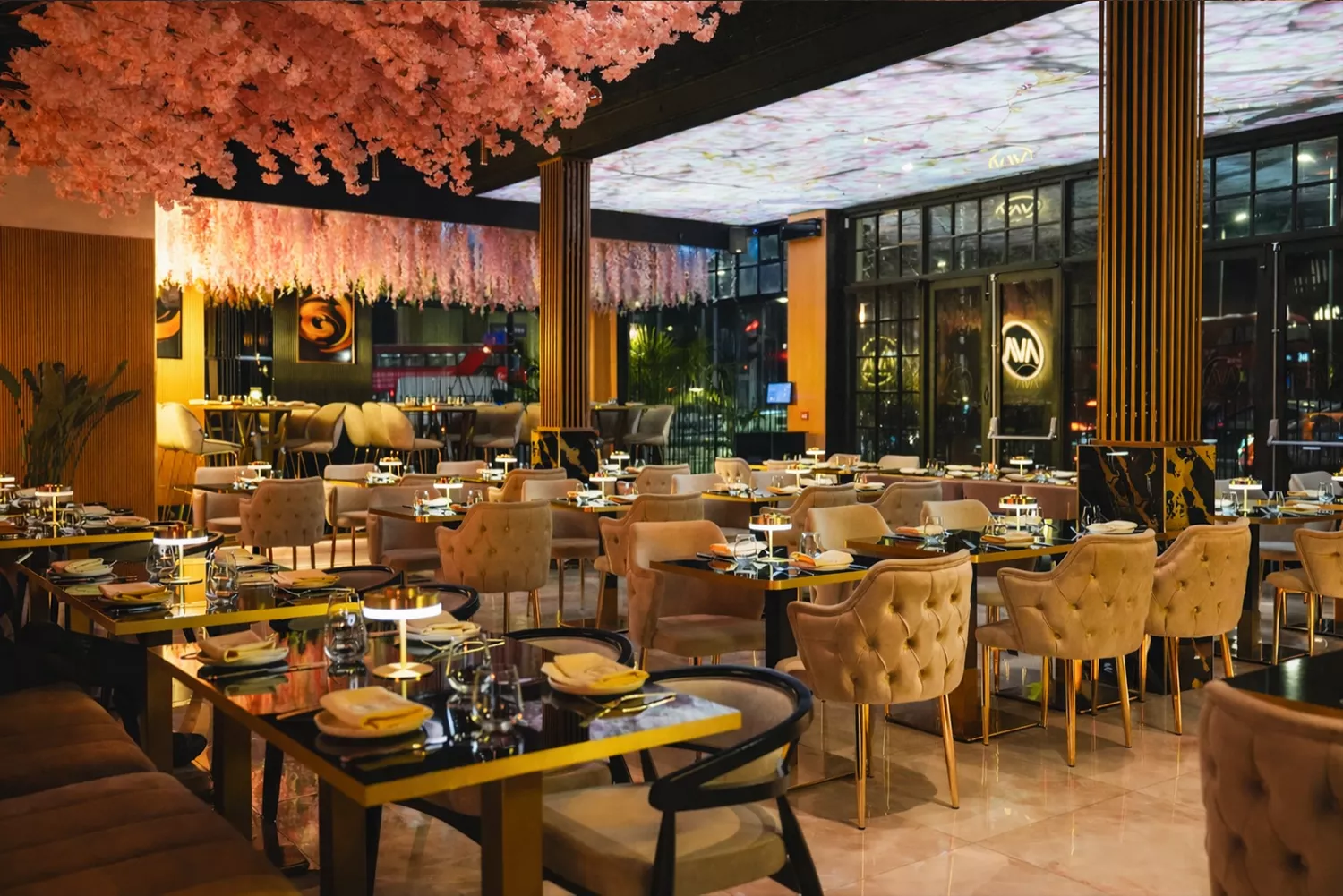 The AVA Steakhouse dining room in Romford under a canopy of blossom